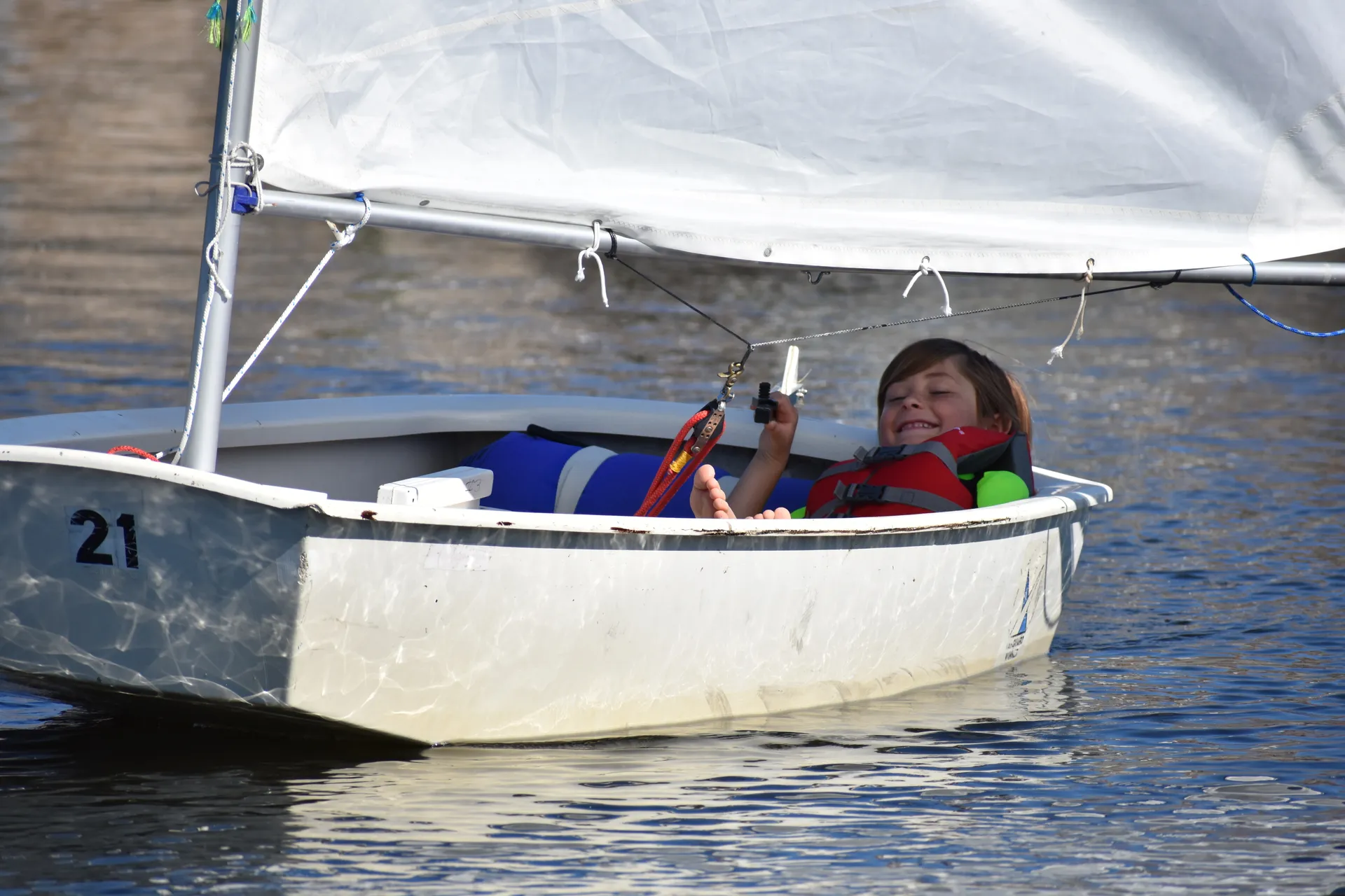Young sailor at the helm